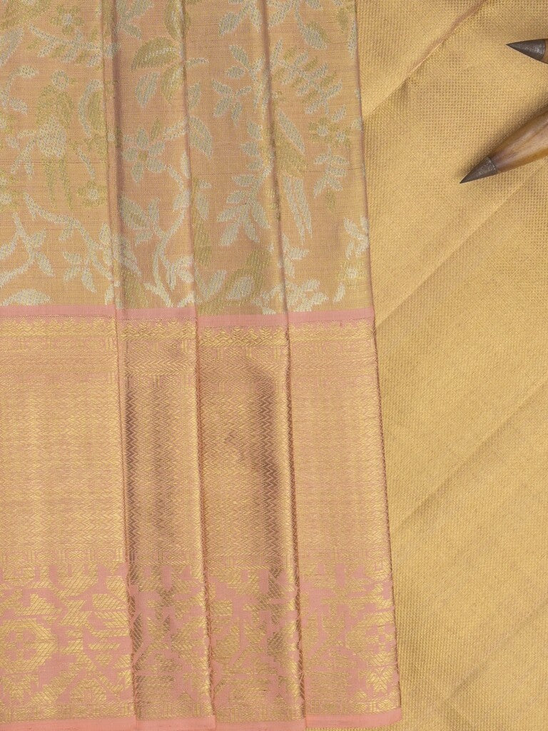 Traditional bridal kanchi tissue pattu saree in beige color with allover rich zari weaves