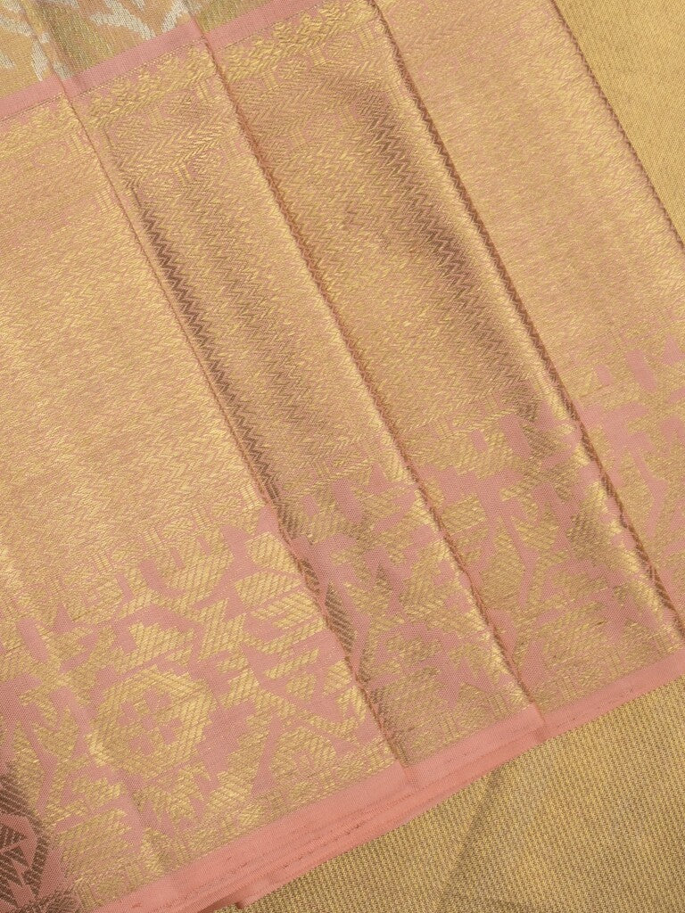 Traditional bridal kanchi tissue pattu saree in beige color with allover rich zari weaves