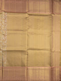 Traditional bridal kanchi tissue pattu saree in beige color with allover rich zari weaves