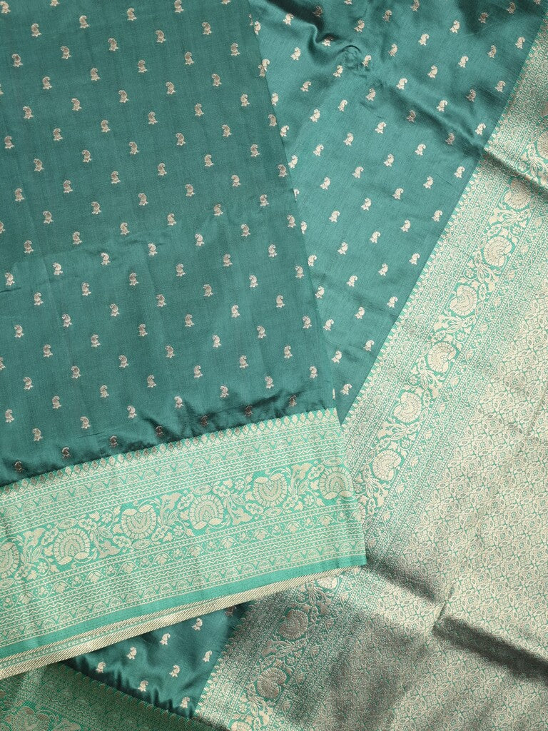 Dupion fancy saree peacock green color allover zari motifs & zari border with rich pallu and plain blouse