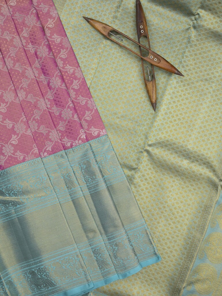 Traditional bridal kanchi tissue pattu saree in pink color with allover rich zari weaves