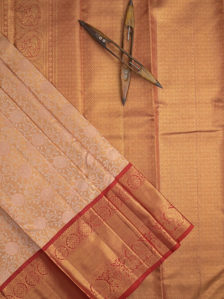 Traditional bridal kanchi tissue pattu saree in cream color with allover rich zari weaves
