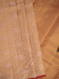 Traditional bridal kanchi tissue pattu saree in cream color with allover rich zari weaves