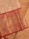 Traditional bridal kanchi tissue pattu saree in cream color with allover rich zari weaves