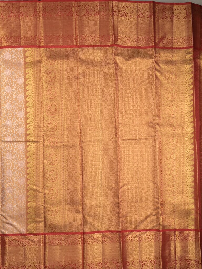 Traditional bridal kanchi tissue pattu saree in cream color with allover rich zari weaves