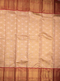 Traditional bridal kanchi tissue pattu saree in cream color with allover rich zari weaves