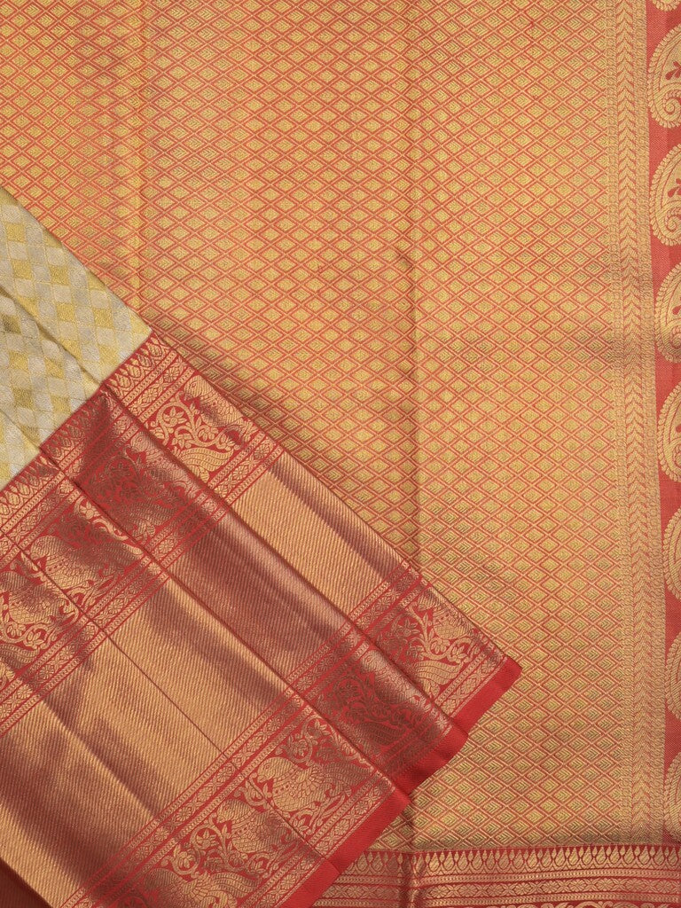 Traditional bridal kanchi tissue pattu saree in cream color with allover rich zari weaves