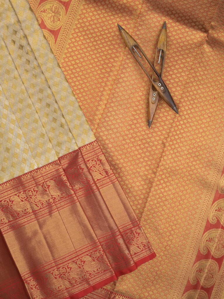 Traditional bridal kanchi tissue pattu saree in cream color with allover rich zari weaves