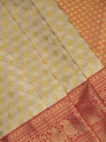Traditional bridal kanchi tissue pattu saree in cream color with allover rich zari weaves
