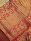Traditional bridal kanchi tissue pattu saree in cream color with allover rich zari weaves