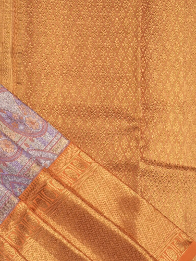 Traditional bridal kanchi tissue pattu saree in purple color with allover rich zari weaves