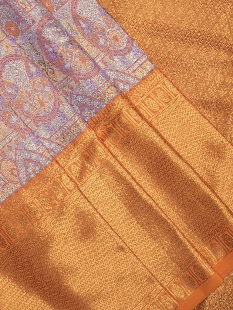 Traditional bridal kanchi tissue pattu saree in purple color with allover rich zari weaves