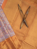 Traditional bridal kanchi tissue pattu saree in purple color with allover rich zari weaves