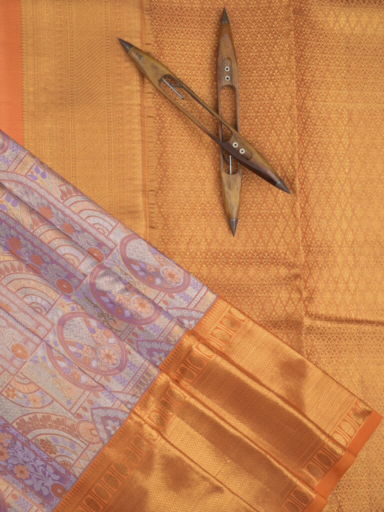 Traditional bridal kanchi tissue pattu saree in purple color with allover rich zari weaves