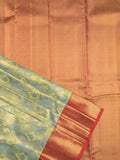 Traditional bridal kanchi tissue pattu saree in blue color with allover rich zari weaves