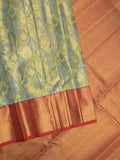 Traditional bridal kanchi tissue pattu saree in blue color with allover rich zari weaves