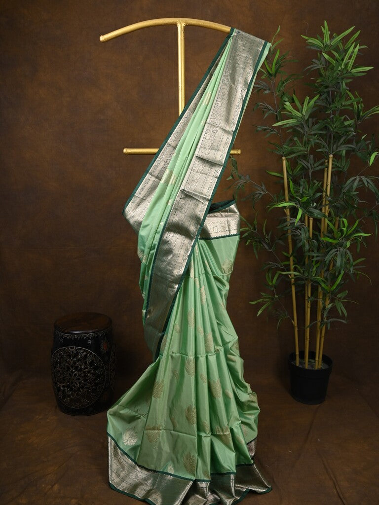Kanchi pattu saree pista green color allover zari weaves & kanchi border with rich pallu and contrast plain blouse