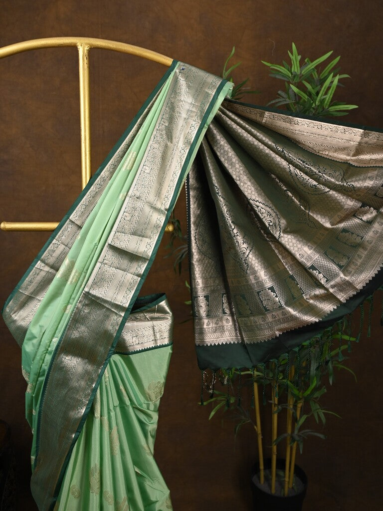Kanchi pattu saree pista green color allover zari weaves & kanchi border with rich pallu and contrast plain blouse