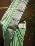 Kanchi pattu saree pista green color allover zari weaves & kanchi border with rich pallu and contrast plain blouse