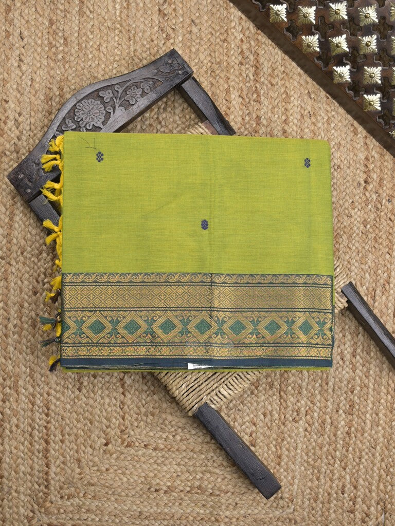 Kanchi cotton saree in parrot green color allover motifs with self pallu and matching blouse