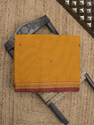 Kanchi cotton saree in golden yellow color allover checks with self pallu and matching blouse