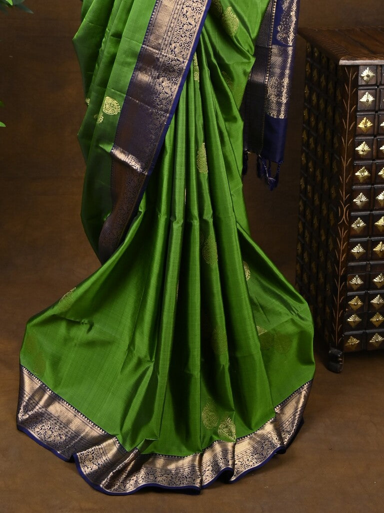 Kanchi pattu saree parrot green color allover zari motifs & zari border with rich pallu and contrast plain blouse