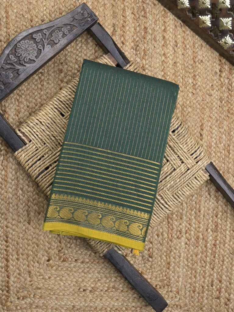 Kanchi cotton saree in dark green color with self pallu and matching blouse