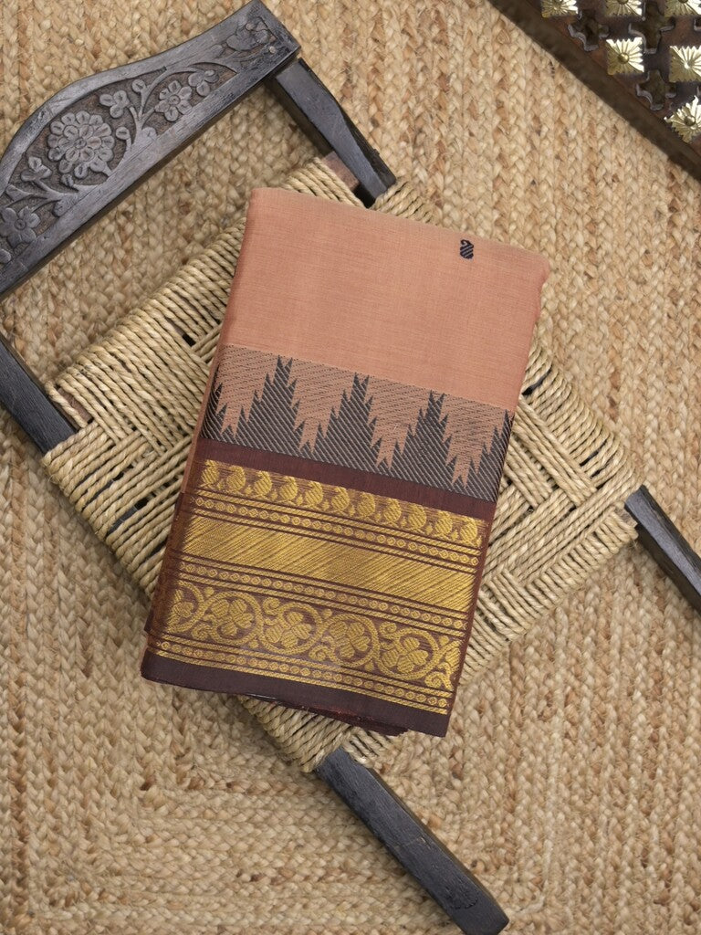 Kanchi cotton saree in peach color allover motifs with self pallu and matching blouse