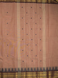 Kanchi cotton saree in peach color allover motifs with self pallu and matching blouse