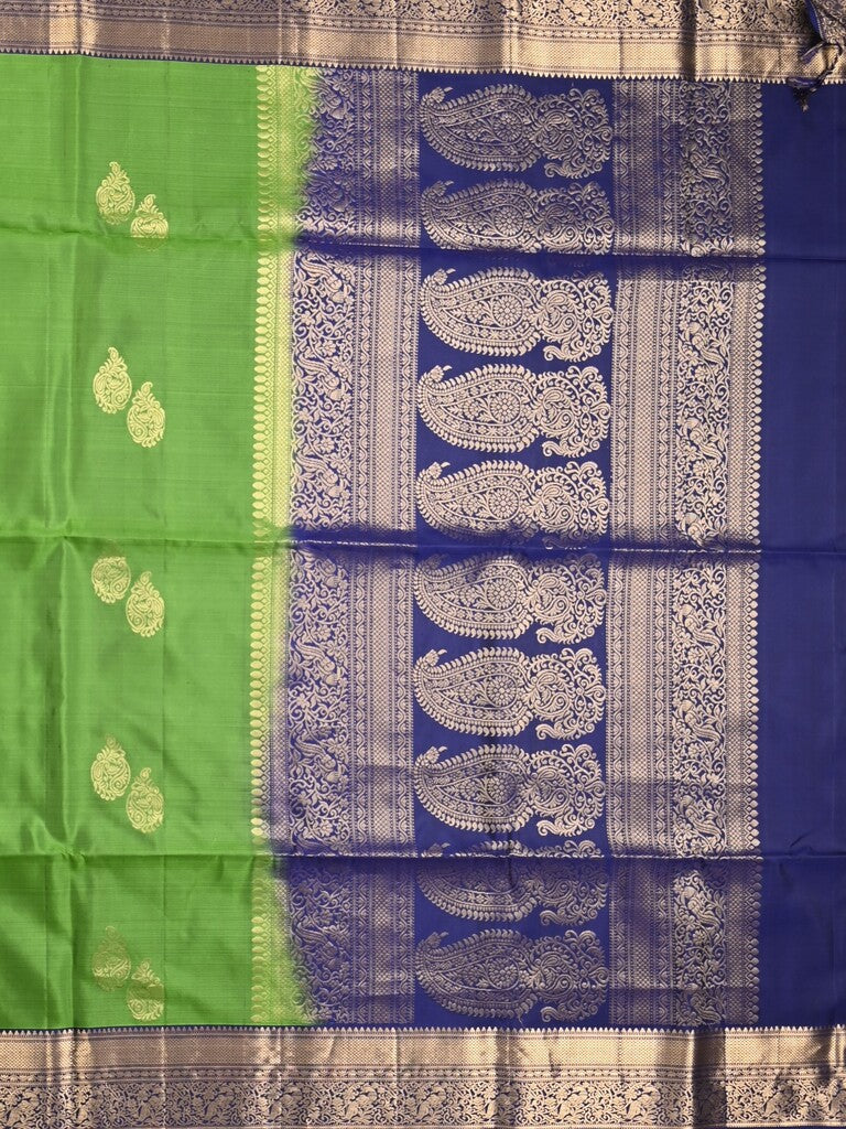 Kanchi pattu saree parrot green color allover zari motifs & zari border with rich pallu and contrast plain blouse