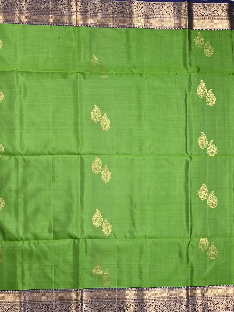 Kanchi pattu saree parrot green color allover zari motifs & zari border with rich pallu and contrast plain blouse
