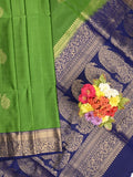 Kanchi pattu saree parrot green color allover zari motifs & zari border with rich pallu and contrast plain blouse