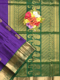 Kanchi pattu saree dark blue color allover zari motifs & zari border with rich pallu and contrast plain blouse