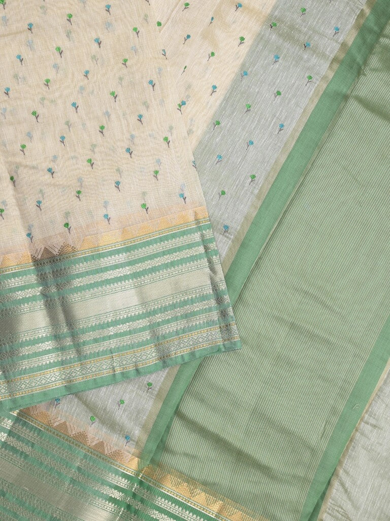 Chanderi fancy saree cream color allover zari motifs & zari border with zari pallu and attached contrast plain blouse