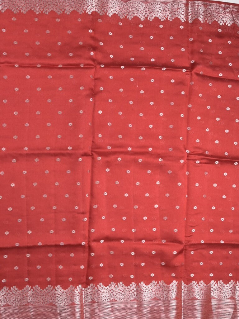 Raw mango fancy saree red color allover zari motifs & zari border with zari pallu and attached self blouse