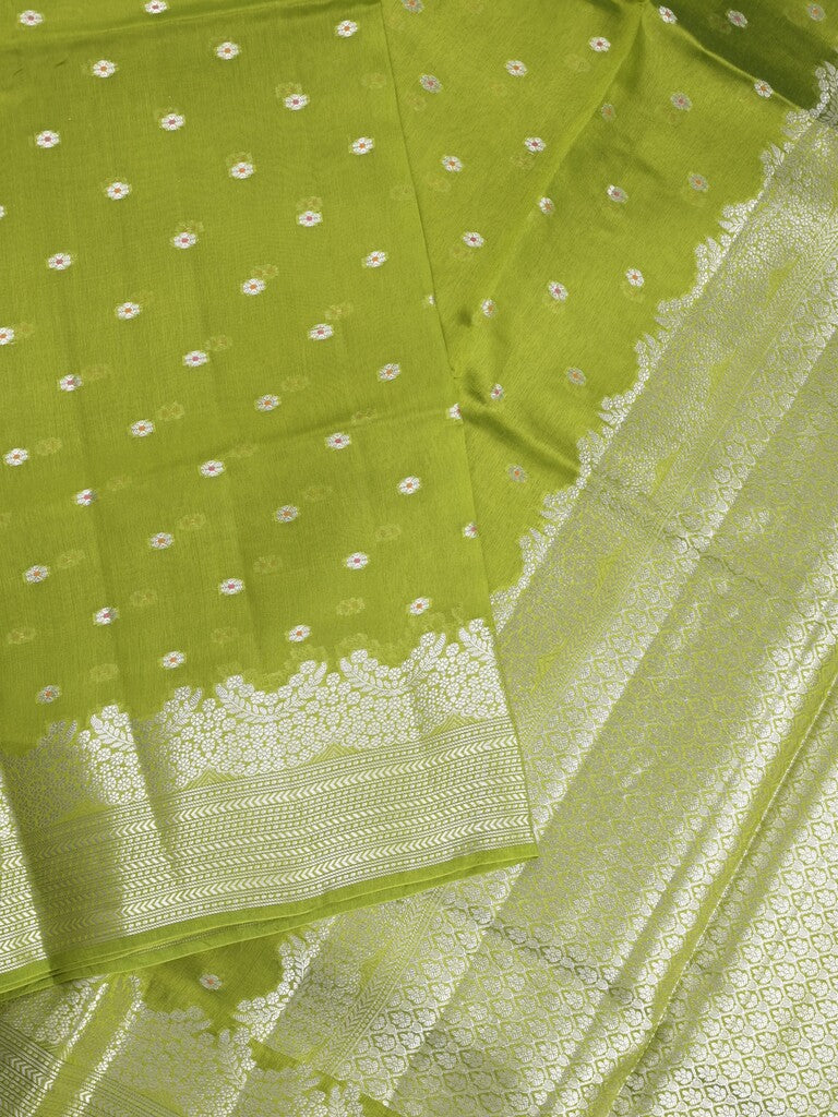 Raw mango fancy saree parrot green color allover zari motifs & zari border with zari pallu and attached self blouse