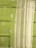 Raw mango fancy saree parrot green color allover zari motifs & zari border with zari pallu and attached self blouse