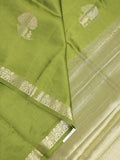 Raw mango fancy saree parrot green color allover zari motifs & zari border with zari pallu and attached self blouse