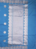 Raw mango fancy saree blue color allover zari motifs & zari border with zari pallu and attached self blouse