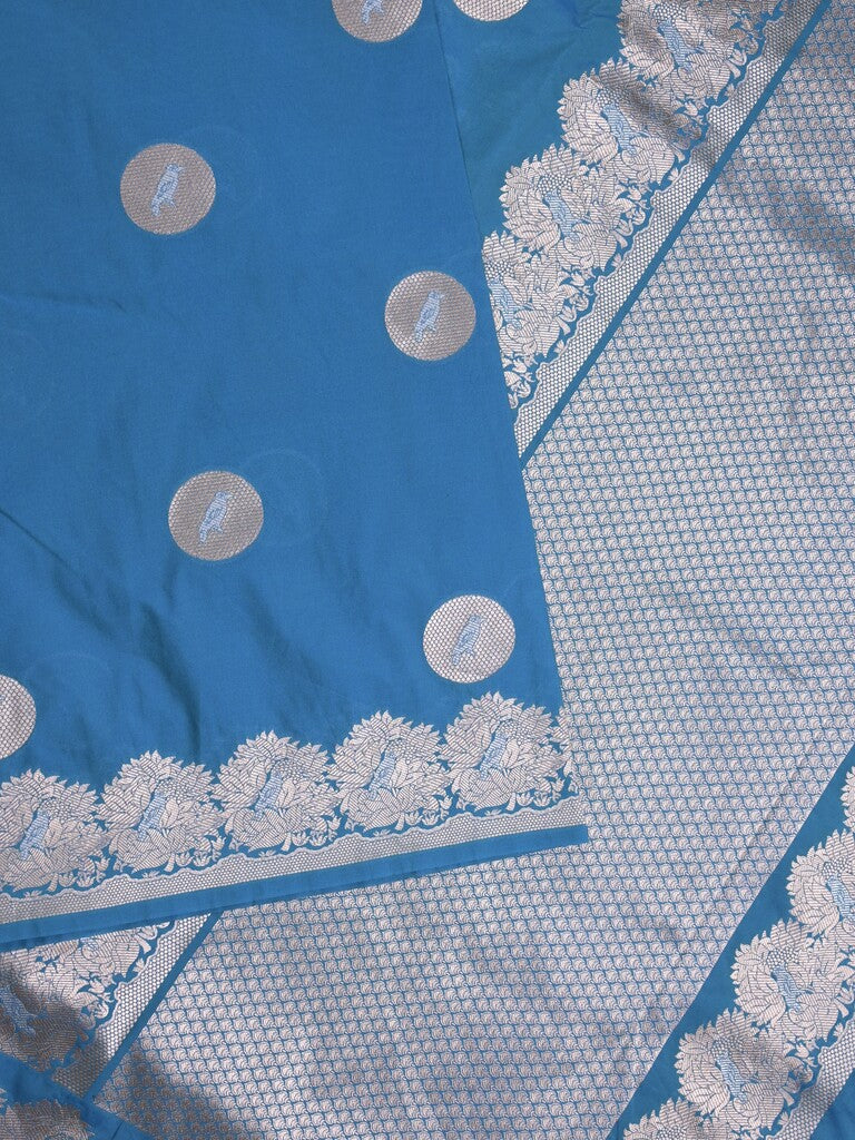 Raw mango fancy saree blue color allover zari motifs & zari border with zari pallu and attached self blouse