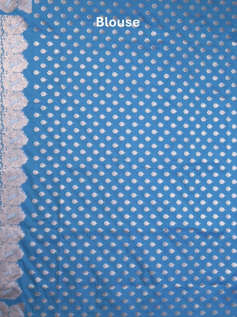 Raw mango fancy saree blue color allover zari motifs & zari border with zari pallu and attached self blouse