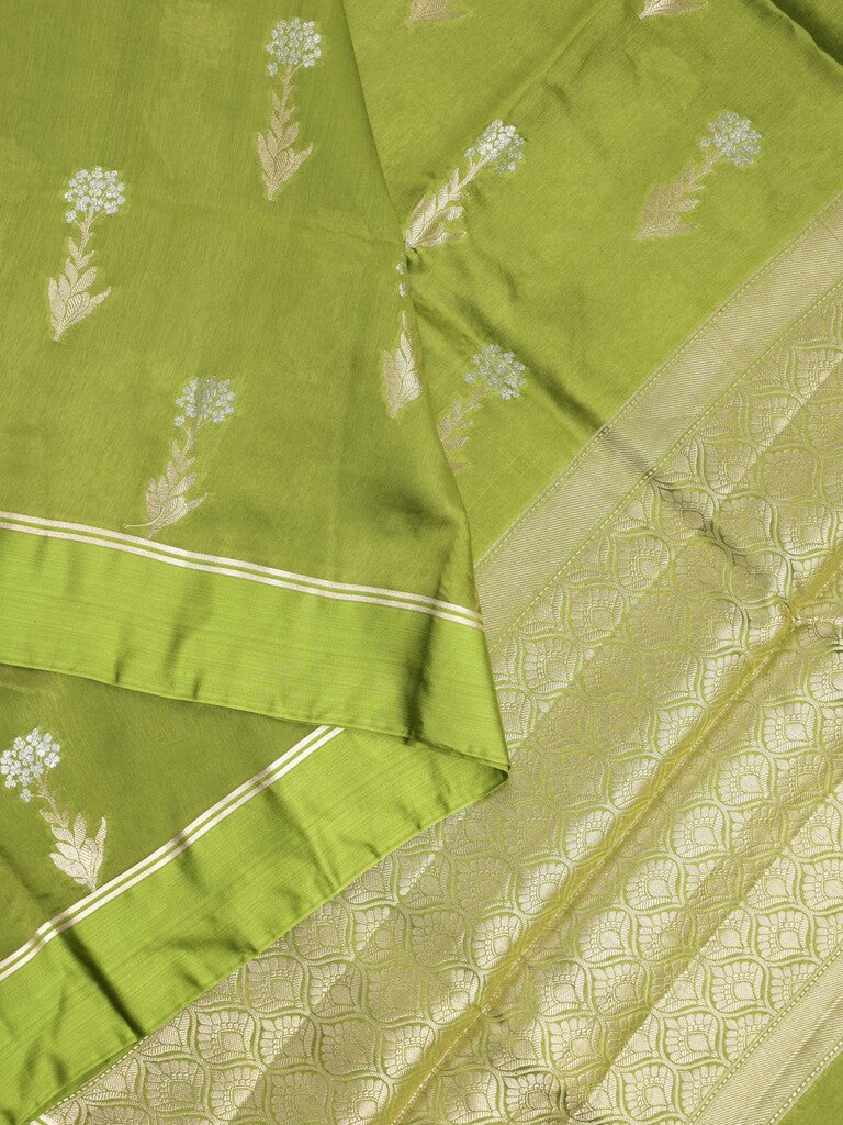 Raw mango fancy saree parrot green color allover zari motifs & zari border with zari pallu and attached self blouse