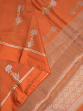 Raw mango fancy saree orange color allover zari motifs & zari border with zari pallu and attached self blouse