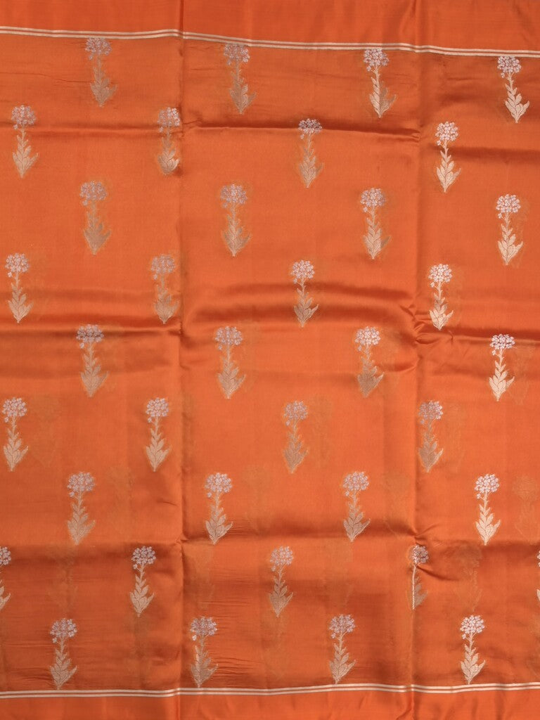 Raw mango fancy saree orange color allover zari motifs & zari border with zari pallu and attached self blouse