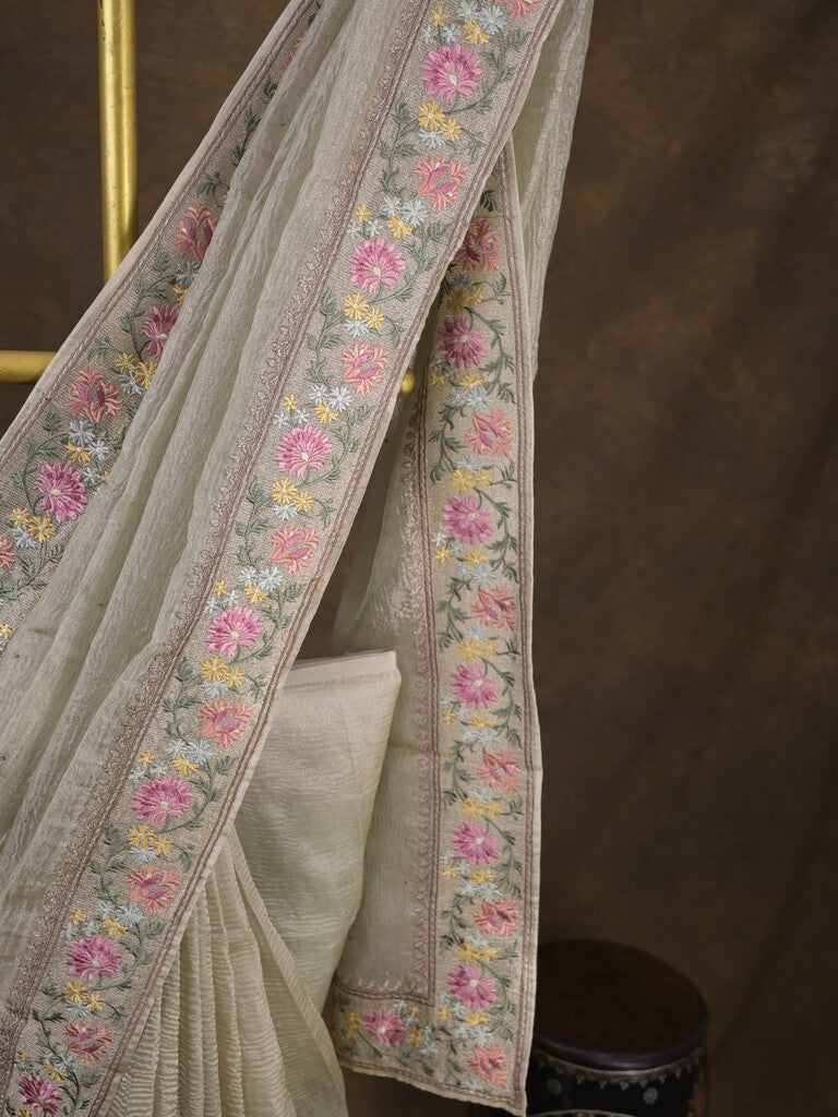 Tissue crush fancy saree cream color allover plain & embroidery border with running pallu and printed blouse