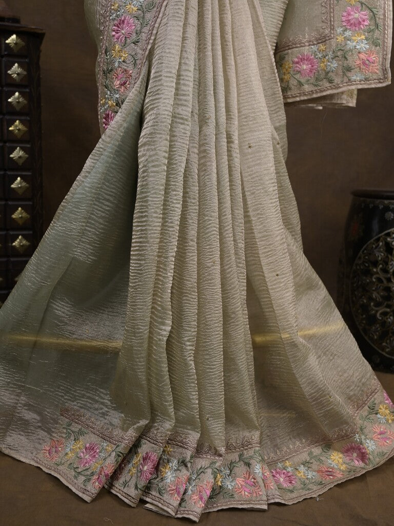 Tissue crush fancy saree cream color allover plain & embroidery border with running pallu and printed blouse