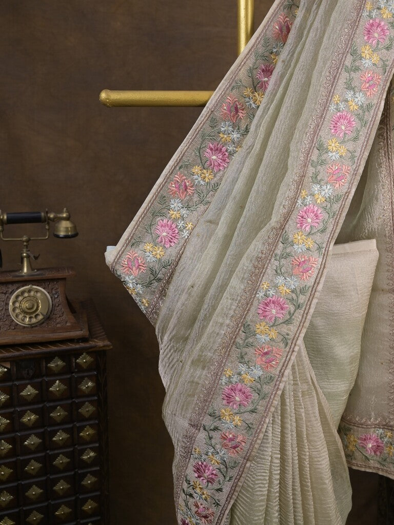 Tissue crush fancy saree cream color allover plain & embroidery border with running pallu and printed blouse