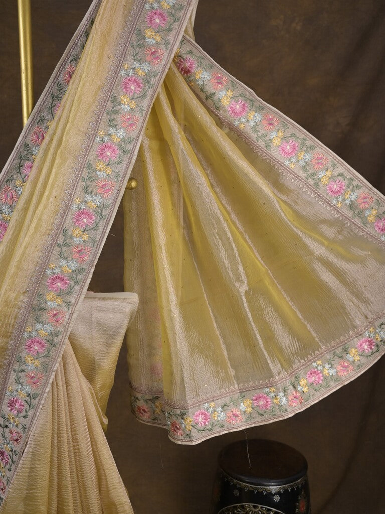Tissue crush fancy saree light yellow color allover plain & embroidery border with running pallu and printed blouse