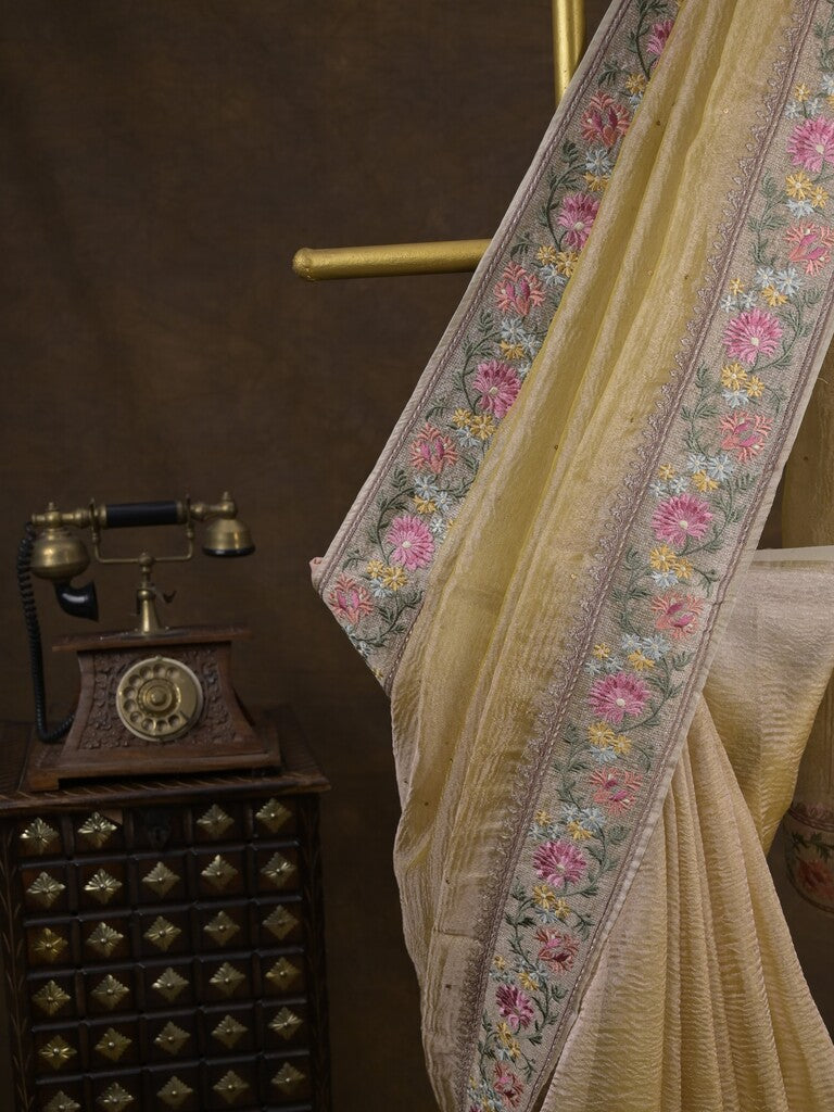 Tissue crush fancy saree light yellow color allover plain & embroidery border with running pallu and printed blouse