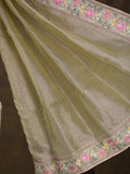 Tissue crush fancy saree light olive green color allover plain & embroidery border with running pallu and printed blouse